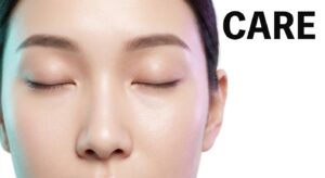Close-up of a serene East Asian woman with healthy under-eye skin